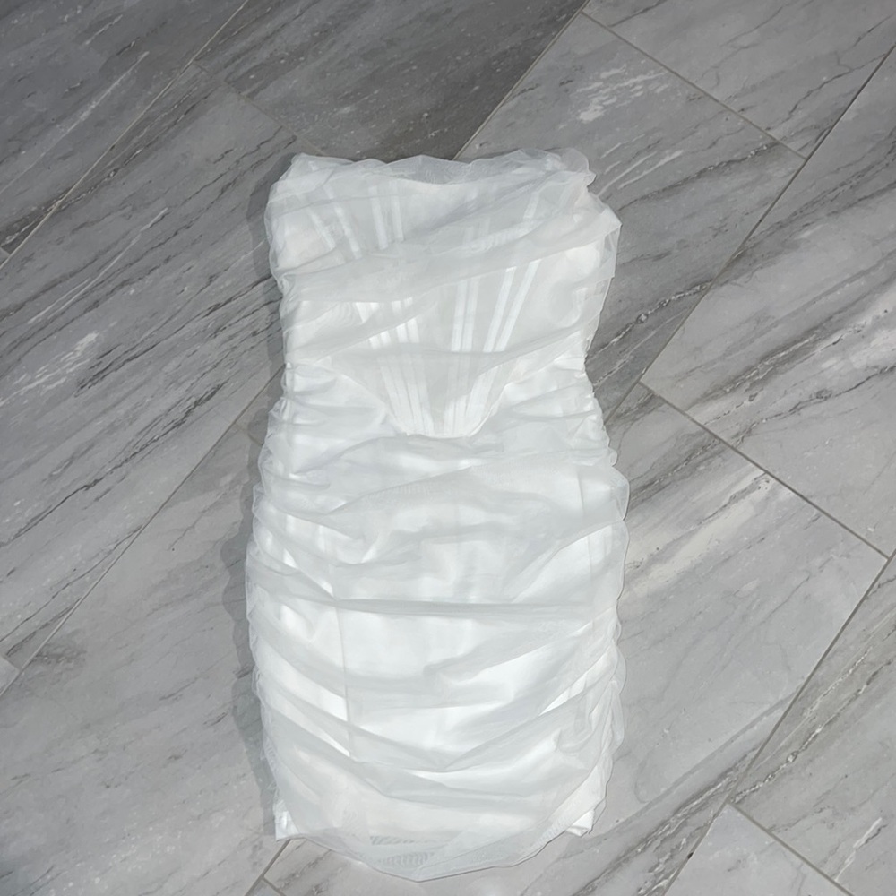 - Revolve Superdown ‘Sonya Bustier Mesh Dress in White’